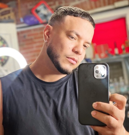 Lorenzo Mendez taking mirror selfies. 